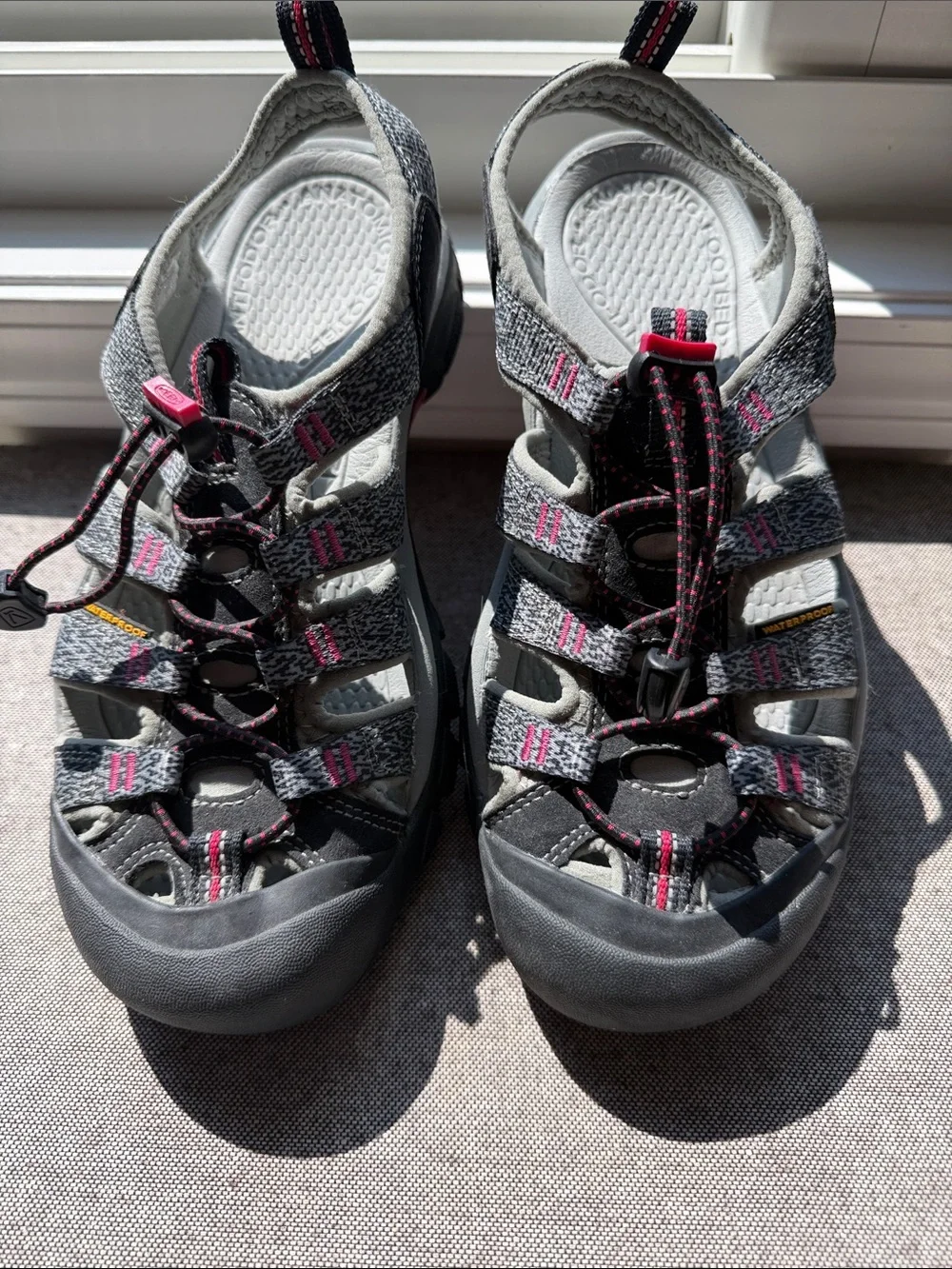 Keen Women’s waterproof Sandals. Gray with pink accents. Rugged soles for hiking